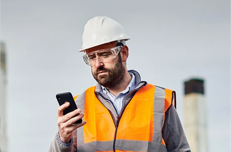 construction worker on mobile phone